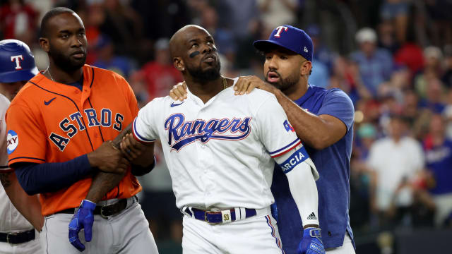 Oct 20, 2023; Arlington, Texas, USA; Texas Rangers right fielder Adolis Garcia (53) is held back by Houston Astros left fielder Yordan Alvarez (44) as Rangers player Ezekiel Duran talks to him after he was hit by a pitch during the eighth inning of game five in the ALCS for the 2023 MLB playoffs at Globe Life Field. Mandatory Credit: Kevin Jairaj-USA TODAY Sports